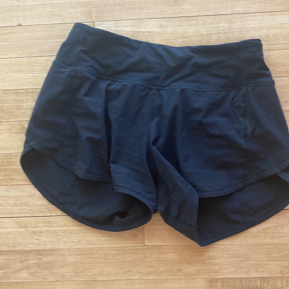 black lululemon size 4 speed up shorts with a 4” inseam.